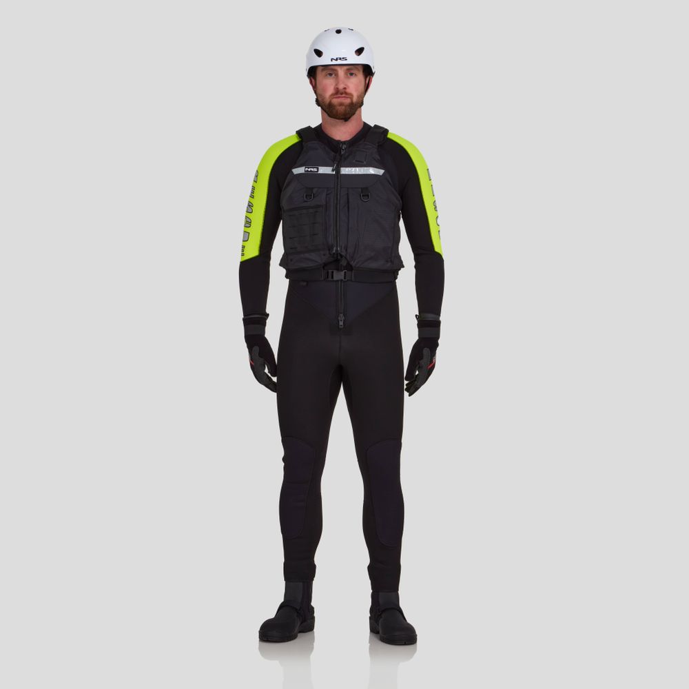 A man faces forward against a plain light gray background wearing the NRS Big Water Guide Hi-Float PFD, a safety helmet, black wetsuit with yellow sleeves, gloves, and boots.