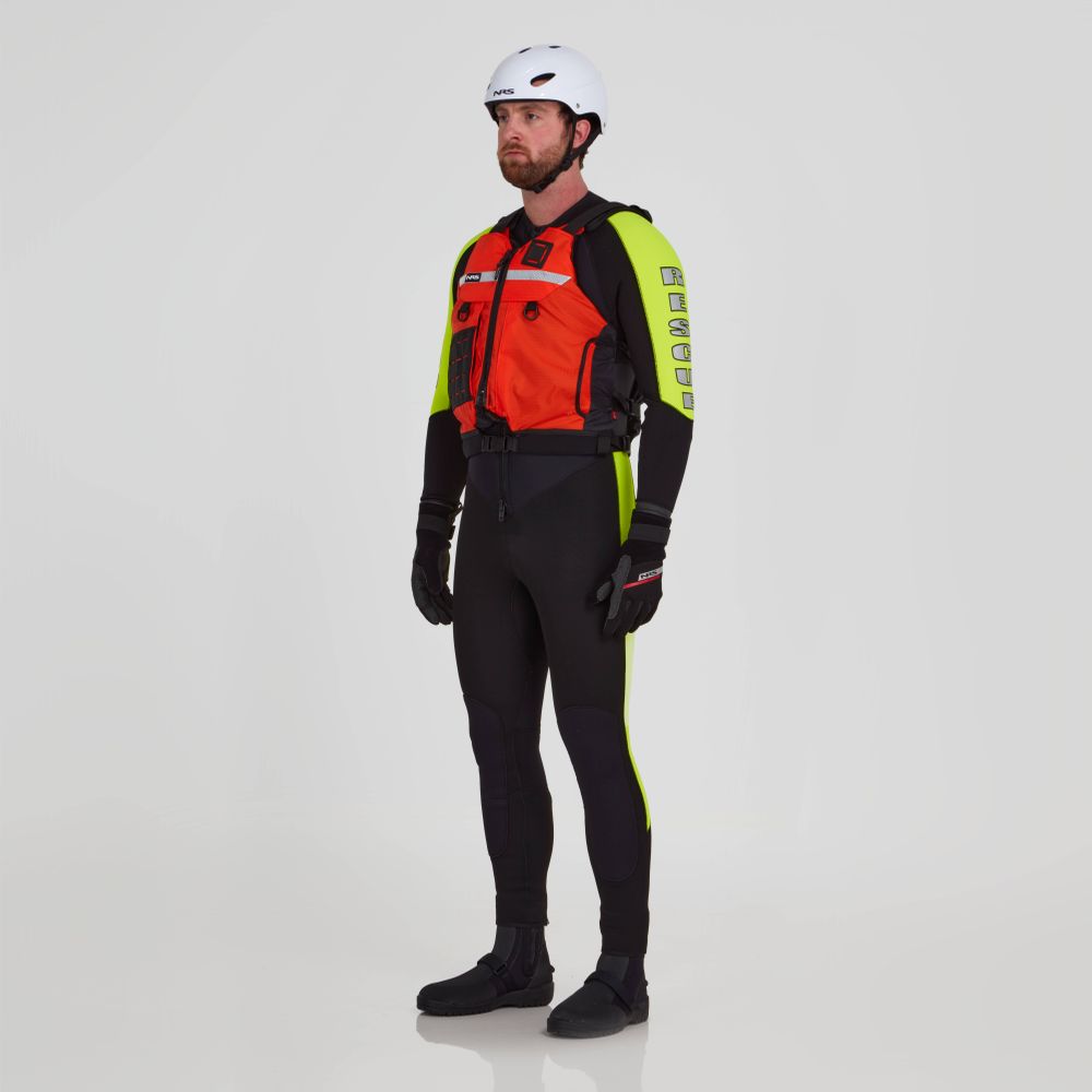 A person wearing an NRS Big Water Guide Hi-Float type III life jacket, white helmet, black gloves, black and yellow wetsuit, and black boots stands against a plain white background.