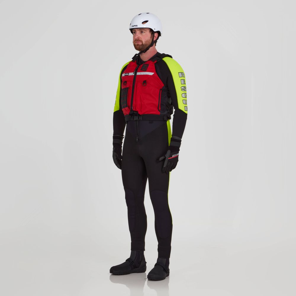 A person stands against a white background wearing an NRS Big Water Guide Hi-Float PFD, a white helmet, black wetsuit with yellow sleeves, black gloves, and black water shoes.