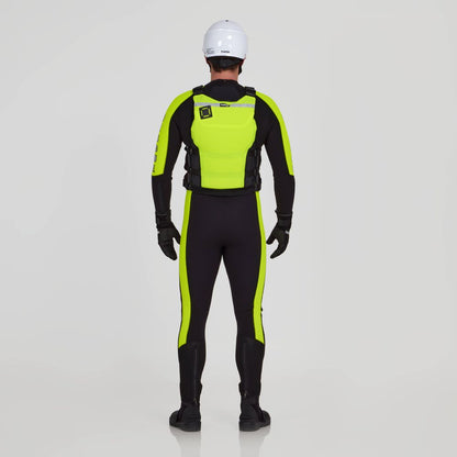A person wears the NRS Big Water Guide Hi-Float PFD with a white helmet, black and neon yellow wetsuit, gloves, and boots, seen from behind against a plain light background.