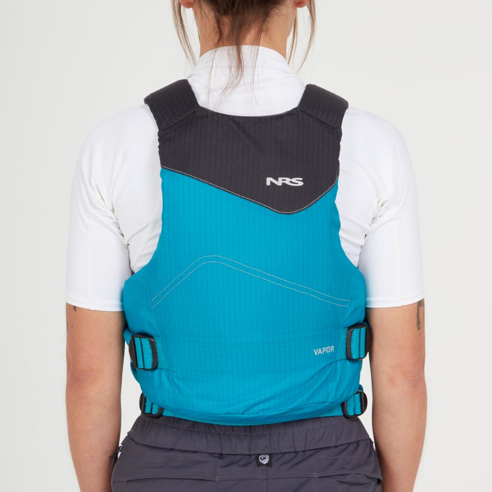 A person wearing an NRS Vapor PFD life jacket in blue and black over a white shirt, viewed from the back—ideal for paddling adventures.