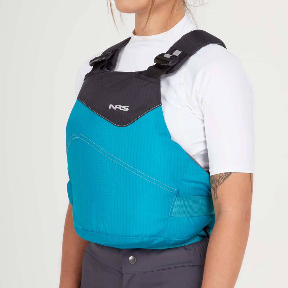 A person wearing the NRS Vapor PFD life jacket over a white shirt is shown from the side against a plain background, ready for paddling.