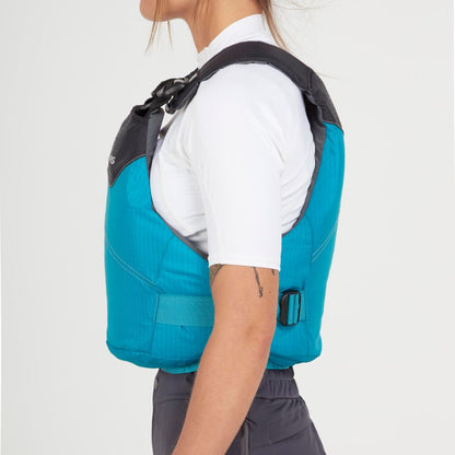 A person in profile wears an NRS Vapor PFD life jacket in blue over a white short-sleeve shirt, standing against a plain background.