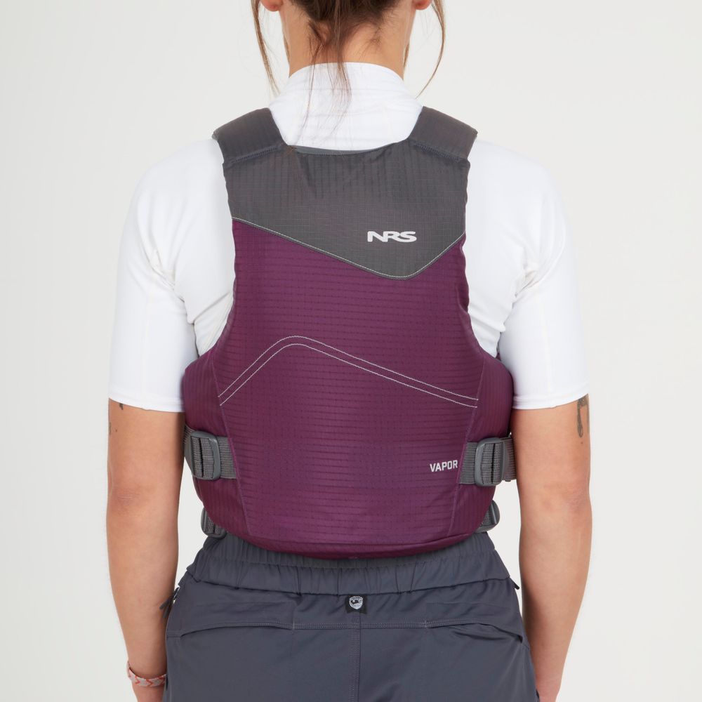 A person in an NRS Vapor PFD life jacket in purple and grey, worn over a white shirt and viewed from the back against a plain backdrop—perfect for paddling adventures.