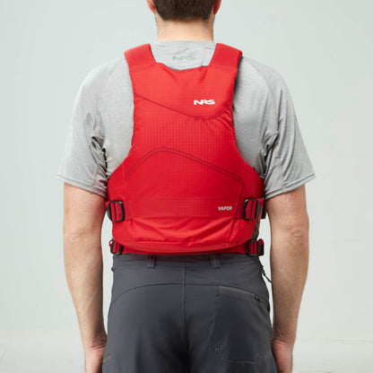 A person in a grey shirt and dark shorts, seen from behind, wears the NRS Vapor PFD life jacket in red—securely fastened and ideal for paddling adventures.
