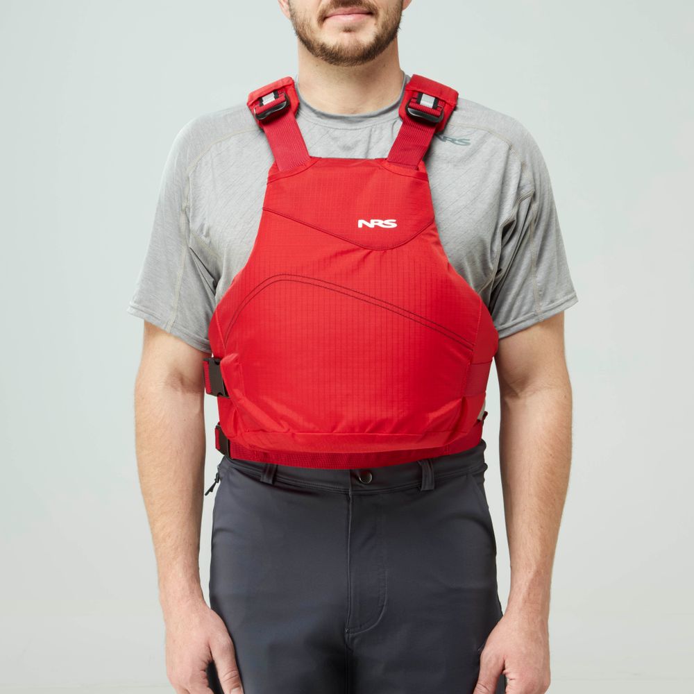 A person in a gray shirt and dark pants models the NRS Vapor PFD life jacket in red against a plain light background—an ideal choice for paddling adventures.