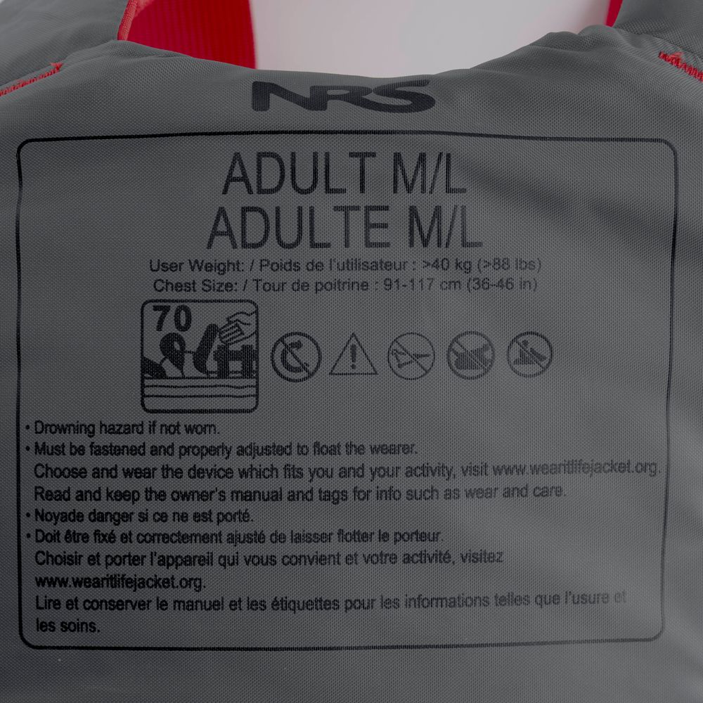 Close-up of an NRS Vapor PFD label showing Adult M/L size, fits chest 91–117 cm for users over 40 kg, with safety instructions in English and French—perfect for paddling.