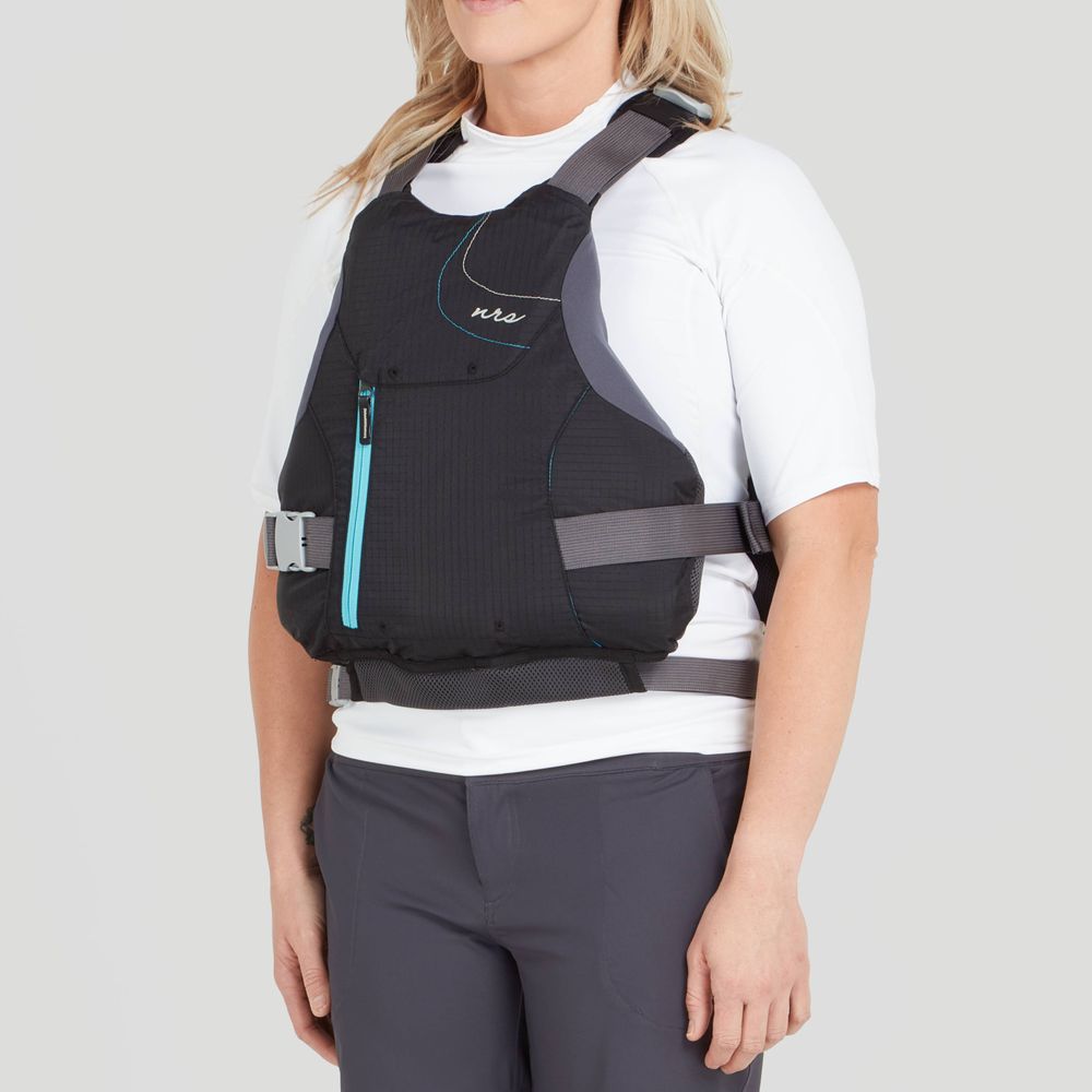 Someone is wearing the NRS Siren PFD - Women's, featuring an adjustable fit, over a white shirt and dark pants against a plain backdrop, offering both style and comfort.
