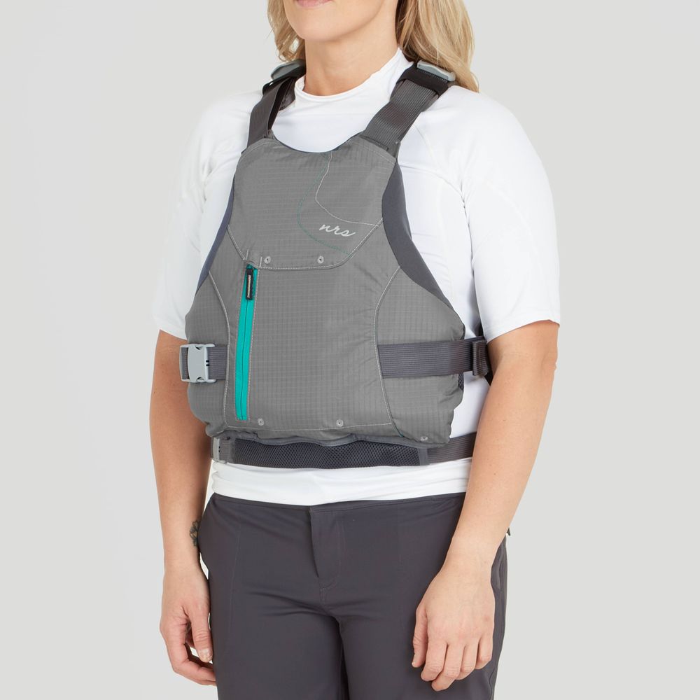 A person wearing the NRS Siren PFD for women over a white shirt, featuring an adjustable fit and zippered pocket, ensures comfort. Designed with precision, it includes adjustable straps for a secure and personalized experience.