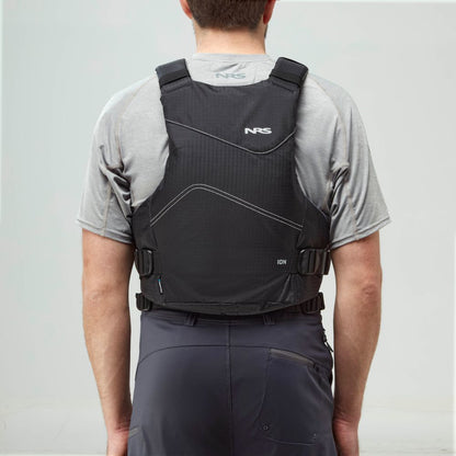 A person in a grey t-shirt and dark grey shorts is shown from the back, wearing the NRS Ion PFD life jacket with adjustable straps and US Coast Guard certification.