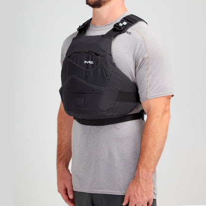 Modeling the Ion PFD by NRS, a person showcases the black tactical vest, complete with ultra-soft foam for extra comfort, over a gray t-shirt.