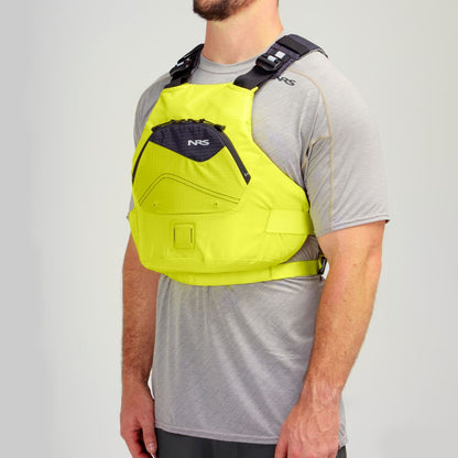 A person wearing a gray shirt and the Ion PFD by NRS, featuring a bright yellow Type III design with black straps and ultra-soft foam, stands in a neutral pose against a plain background.
