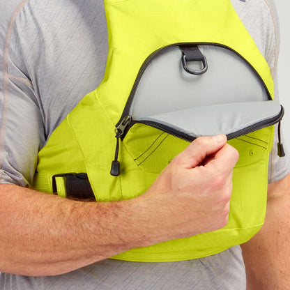 A person opens the front zippered pocket of the bright yellow NRS Ion PFD life jacket, revealing its gray interior lining.