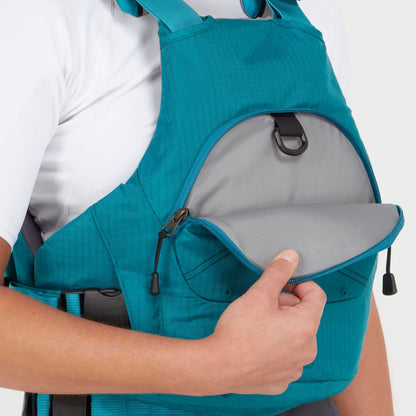Someone wears the NRS Ion PFD, a teal life jacket featuring a front zippered pocket open to show its gray interior and an inner black attachment loop.