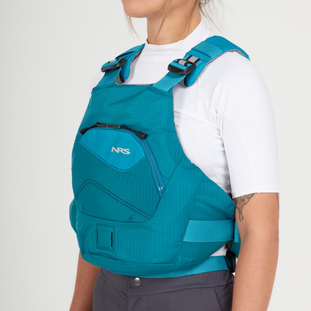 Someone is wearing an NRS Ion PFD with ultra-soft foam in blue, paired with a white shirt.