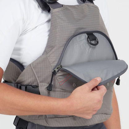 A person wearing an NRS Ion PFD, featuring an ultra-soft foam gray life jacket with a front zipper pocket partially open to show the interior.