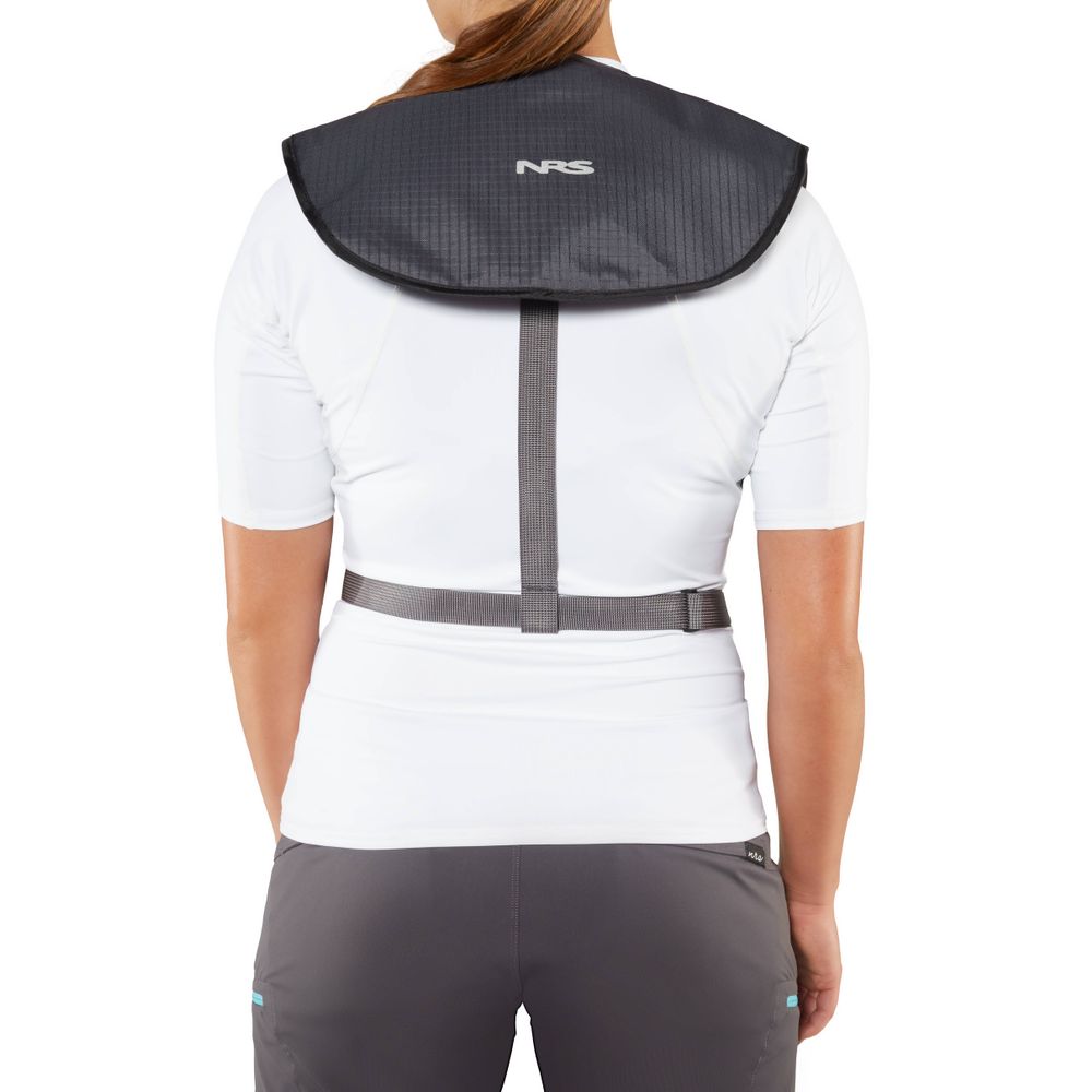 A person in a white shirt and gray pants adds safety with a sleek black protective shoulder and neck pad, featuring an NRS Matik Inflatable PFD tucked over the back.