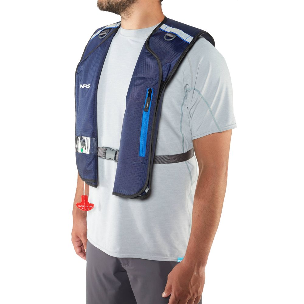 Someone wearing a blue NRS Matik Inflatable PFD over a light gray shirt and dark pants.