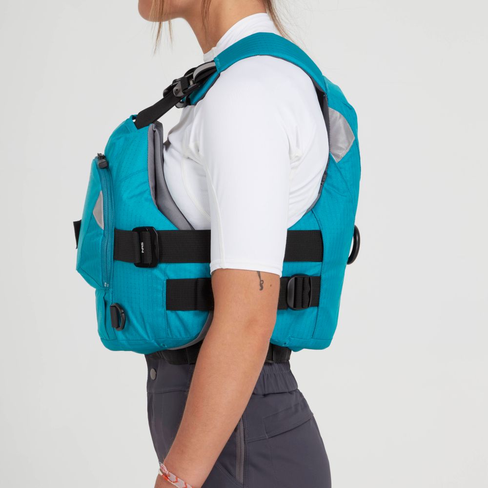 A person wearing the NRS Ninja Pro PFD rescue vest in teal over a white shirt and gray pants, shown from the side against a plain background.