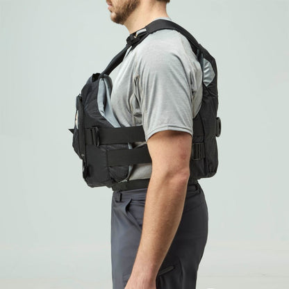 A man in a gray t-shirt and dark pants is shown from the side wearing an NRS Ninja Pro PFD.
