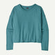 The Mainstay Top by Patagonia, a teal long-sleeve shirt with a round neckline, is laid flat against a light background.
