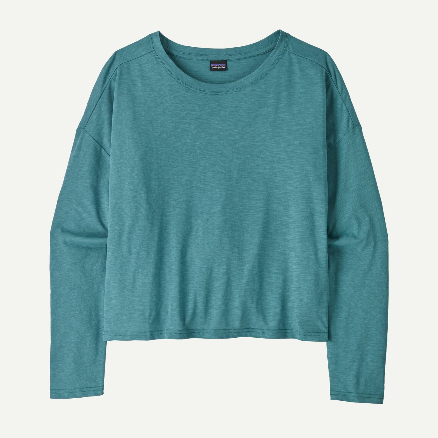 The Mainstay Top by Patagonia, a teal long-sleeve shirt with a round neckline, is laid flat against a light background.