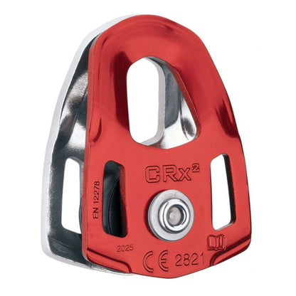 The NRS SMC CRx 1in Rescue Pulley features red and silver coloring, certification markings, and is designed for rope or cable systems—ideal for Z-Drag rescue setups.