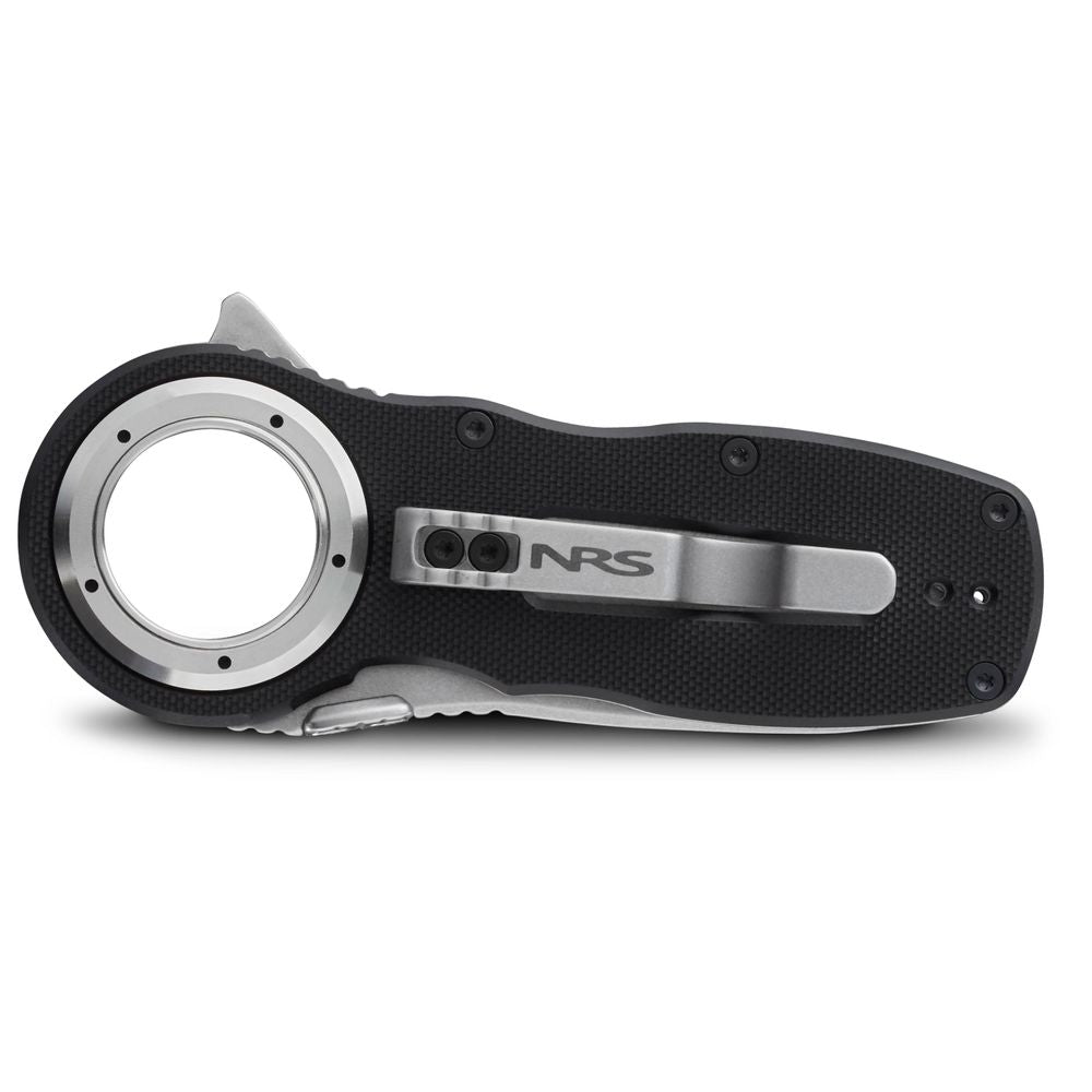 The NRS Pilot Access Knife is a black and silver folding knife featuring a stainless steel, serrated blade with a circular opening near the handle and a side clip.