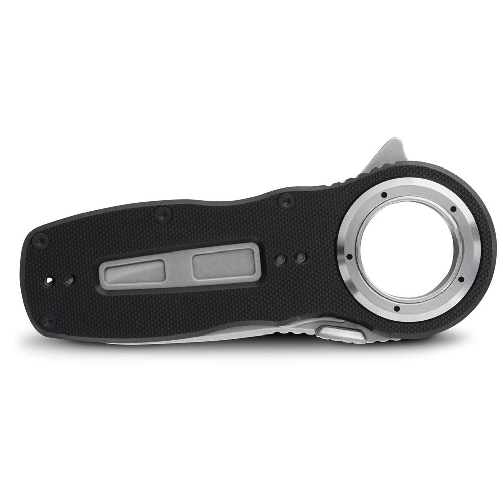 A black Pilot Access Knife by NRS, featuring a closed folding design with a stainless steel blade and an all-weather G10 textured handle, is lying flat.