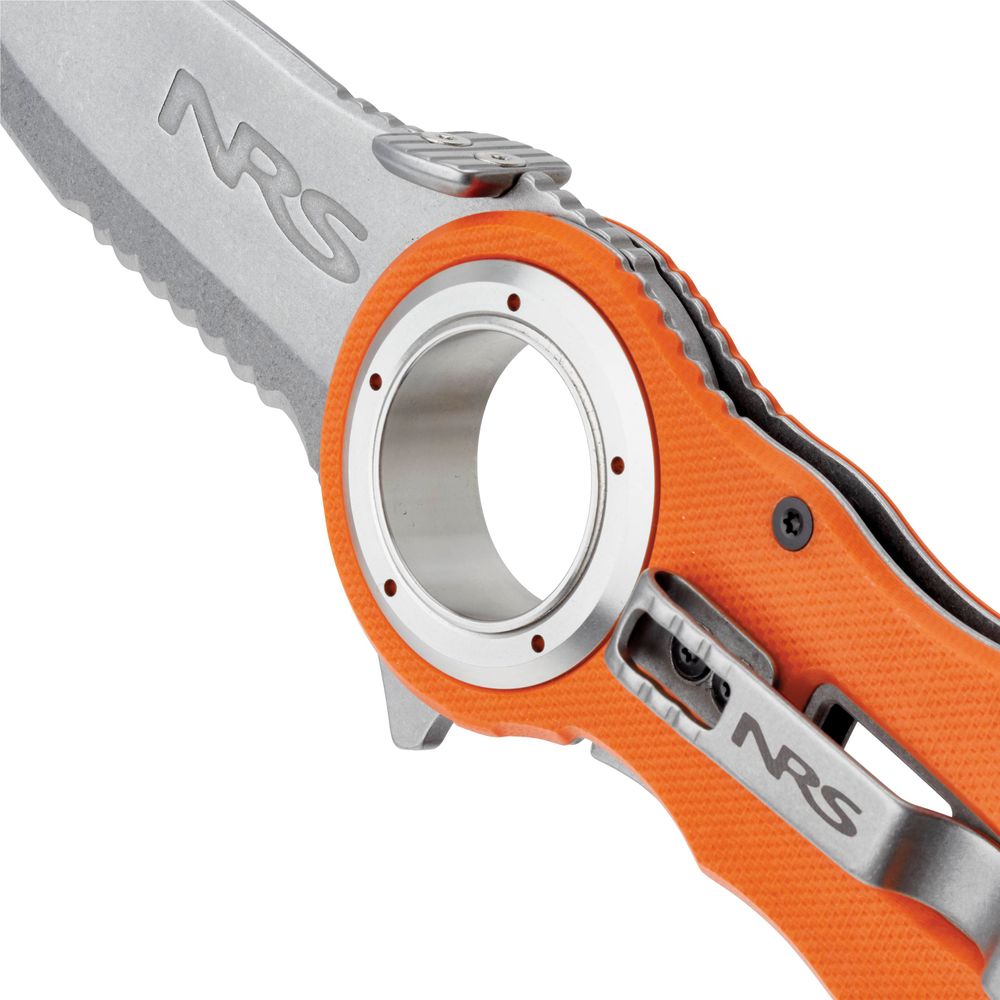 Close-up of a silver and orange NRS Pilot Access Knife with a serrated stainless steel blade featuring the NRS logo. The handle includes a circular hole and displays the brand name.