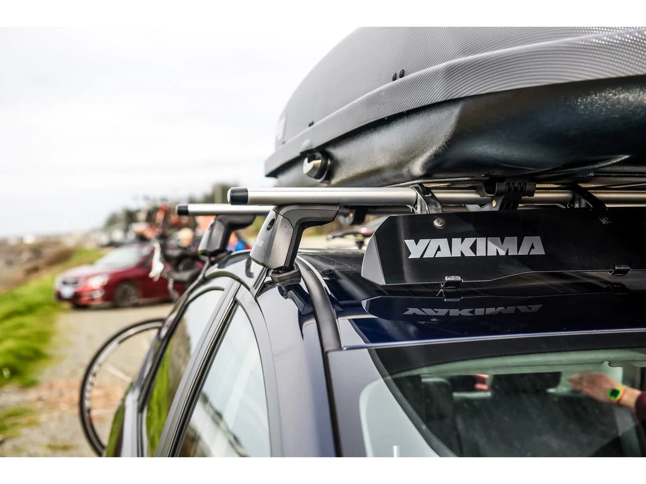 A car with a Yakima JetStream Crossbar on top of it.