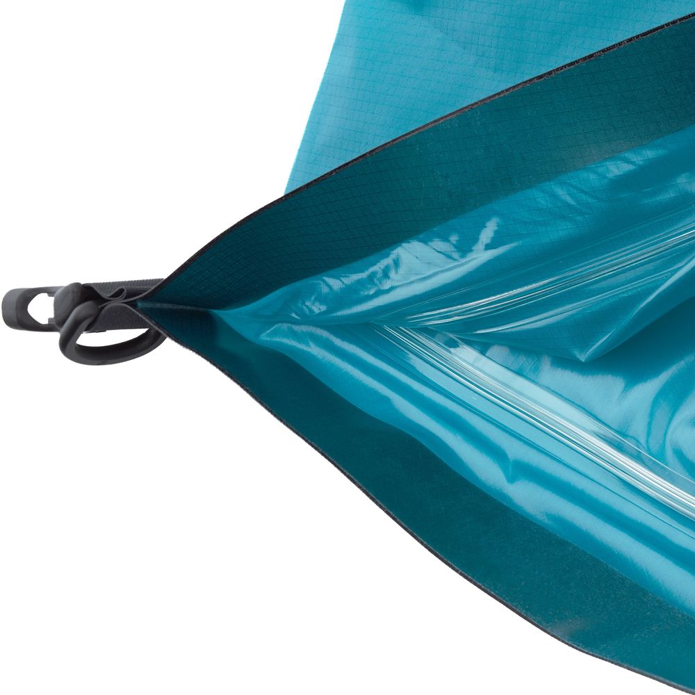 Close-up of the NRS HydroLock Kayak Stow Float, a durable blue waterproof dry bag designed for floatation with kayaks. It includes an inner lining, black trim, and side clip, perfect for adventure seekers.