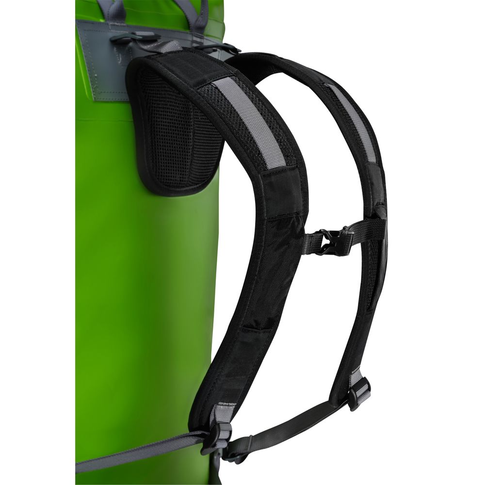 The NRS Bill's Bag in green includes black backpack straps, padded sections, an adjustable chest strap, and convenient compression straps for optimized packing.