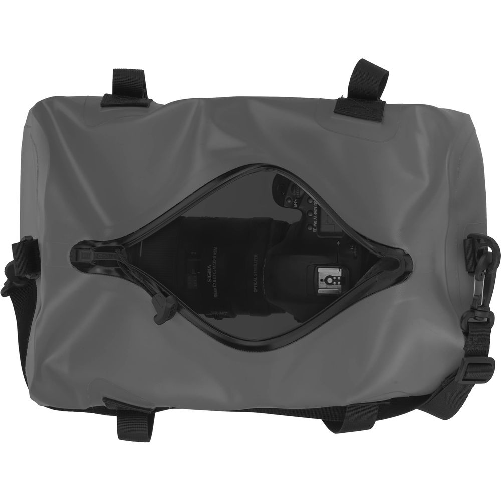 Top view of a gray NRS Expedition DriDuffel with a clear window shows a camera inside. The waterproof duffel has a TRU Zip zipper closure and adjustable black straps.