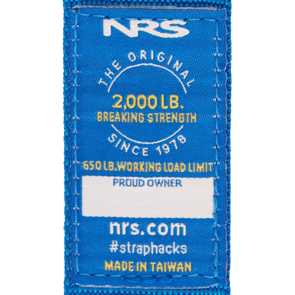 Blue label features "NRS," "2,000 lb breaking strength," and "650 lb working load limit" with a durable buckle. Includes "#straphacks" and website nrs.com. Made in Taiwan, these NRS Heavy Duty 1.5in Wide Cam Straps ensure secure gear storage.