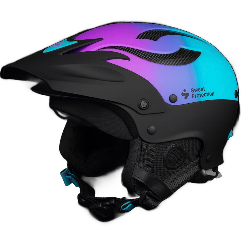 The Sweet Protection Rocker Helmet features a black and blue gradient, built-in visor, ear protection, adjustable strap, TLC Shell Technology, and bold logo—blending style with safety inspired by the brand’s famed whitewater helmets.