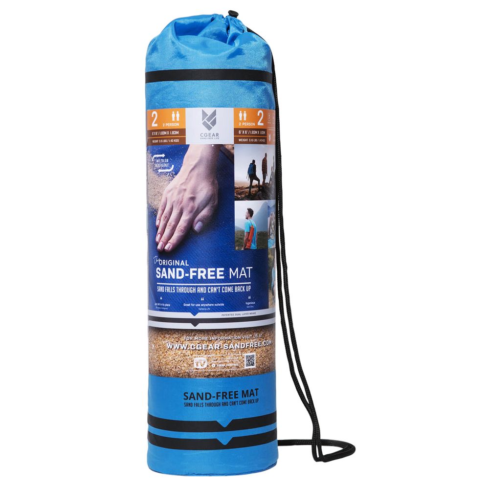 A blue cylindrical carry bag holds an NRS Sand Free Multi Mat with dual weave construction, featuring images of the mat in use and detailed product info on the label.