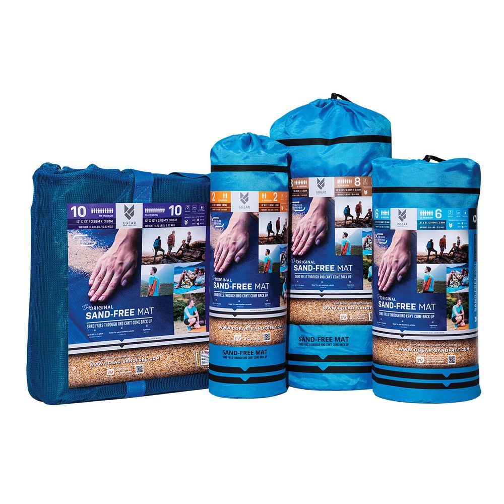 Four upright blue NRS Sand Free Multi Mat packages in various sizes highlight their dual weave construction, ideal for beach days or camping tarps. Packaging showcases hand and beach images, emphasizing versatility and practicality.
