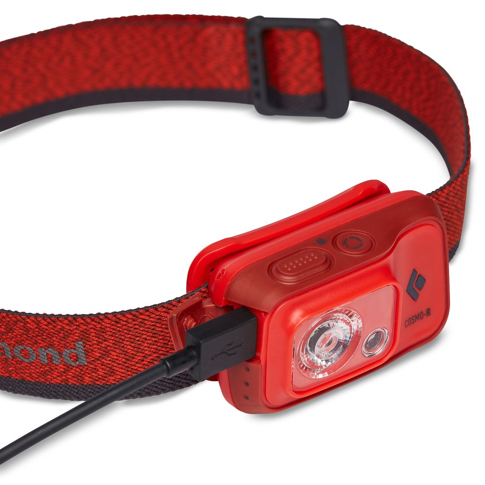 The Black Diamond Cosmo 350R Rechargeable Headlamp features a red and black design, adjustable strap, USB side charging port, and is waterproof—making it perfect for night vision activities.