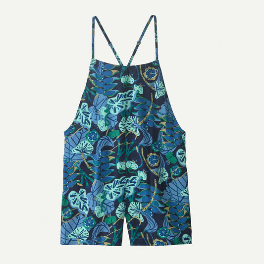 The Patagonia Tidal Threads Romper is a sleeveless short overall with adjustable straps and a blue-green tropical leaf and flower print.