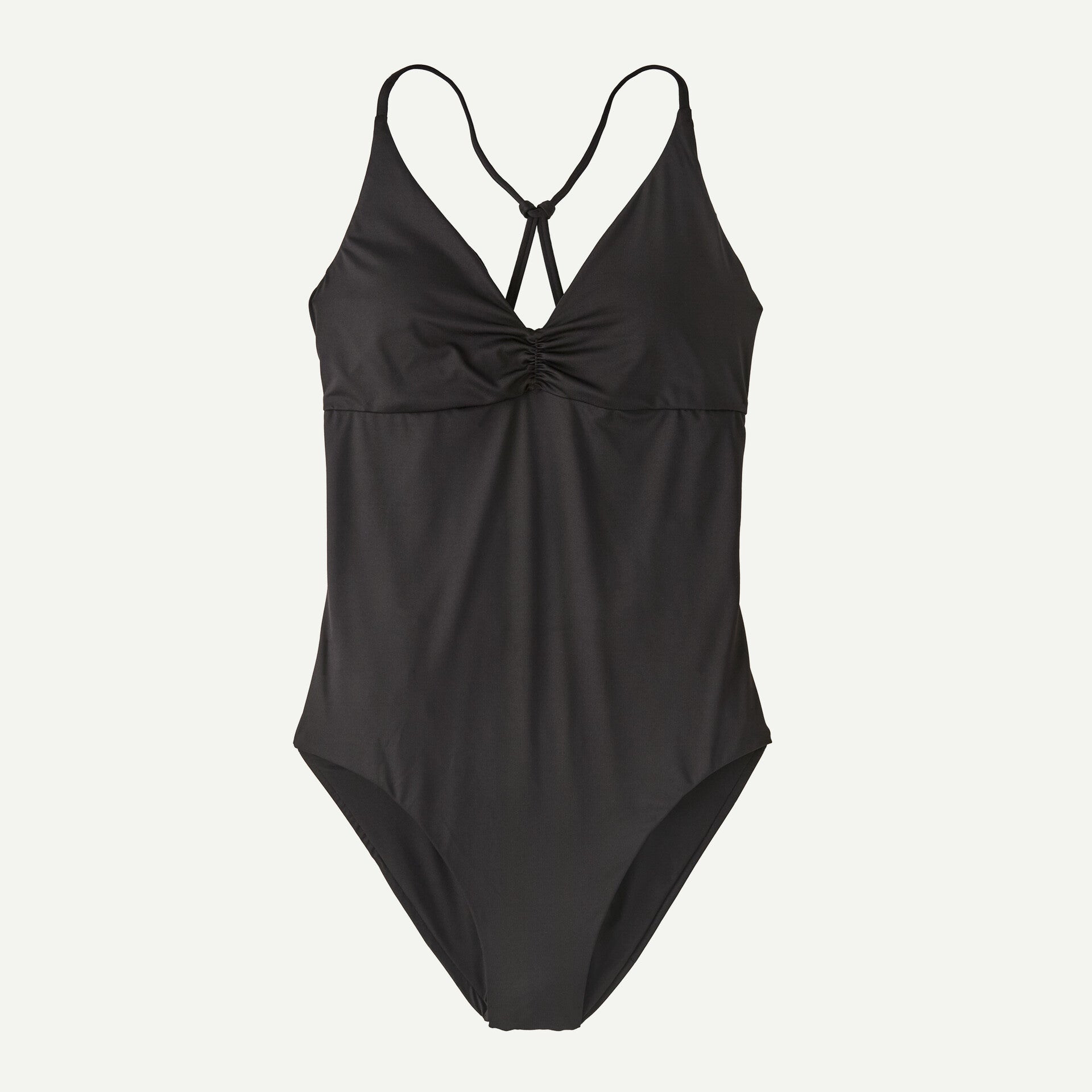 The Cross Shore One Piece by Patagonia, a black swimsuit featuring crisscross straps and chest gathering, is shown on a plain background.