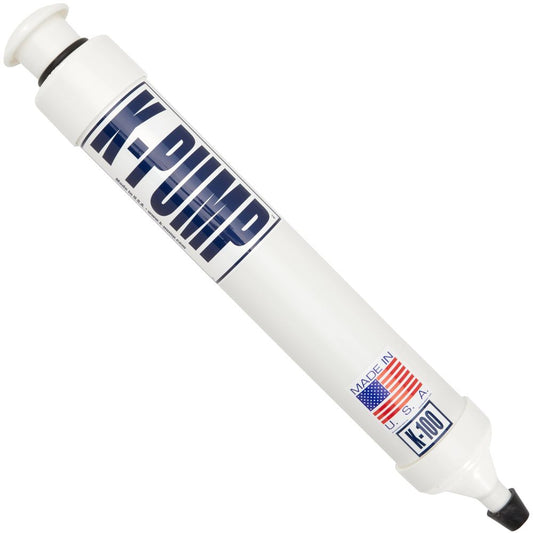 The K-Pump K100 by NRS is a manual hand pump, ideal for inflatable boat valves, featuring "MADE IN U.S.A." text and an American flag. It comes with a black nozzle tip.