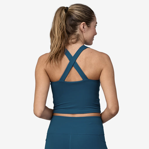 The back view of a woman wearing a Patagonia Reversible Tank.