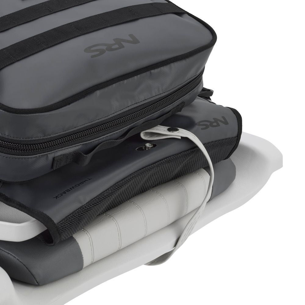Close-up of an NRS Throw Back Fishing Seat Bag in grey, secured with straps on a padded white seat, featuring PVC-free mesh and a visible connecting cable.