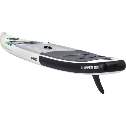 A white and black NRS Clipper 12'6 touring board with green and blue accents, featuring a fin and bungee cord storage area on the deck, is enhanced by Integrated Shaping Technology.