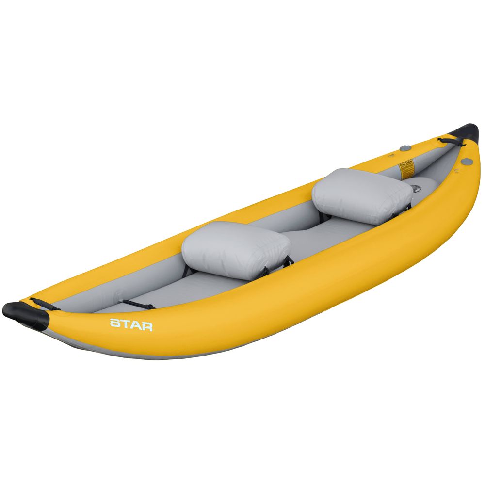 The NRS STAR Outlaw Tandem IK is a yellow inflatable kayak designed for whitewater, featuring two gray seats, a black tip, and crafted with durable PVC. Photographed on a pristine white background.