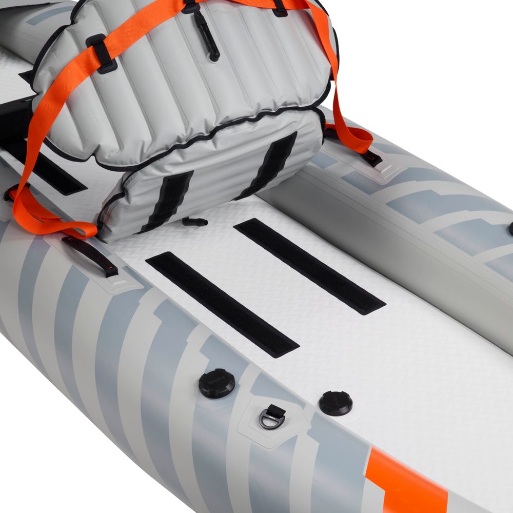 Close-up of the NRS Akamai 110 Inflatable Kayak shows a grey and white seat with orange straps and two long black strips on its PVC-free nylon floor.