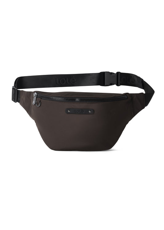 The Lole Taylor Belt Bag features a black design, zippered main compartment, adjustable strap, small front logo patch, and a convenient extra zippered pocket.