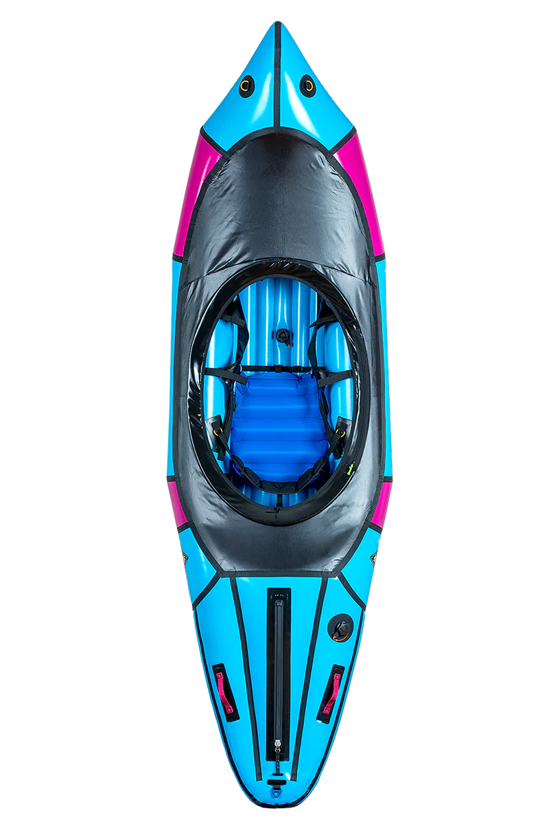 Top view of a sleek Alpacka Valkyrie V3 packraft in blue and black, with a visible seat and footrest, set against a motion-blurred striped background.