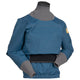 A blue Immersion Research Aphrodite Dry Top - Women's equipped with a black waistband, designed for kayaking and water sports, featuring gray cuffs and neck seal for waterproof protection. Made from waterproof breathable recycled polyester, this top ensures durability and comfort.